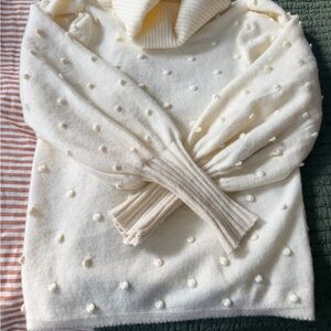 Elegant Cream Turtleneck Sweater with Textured Dots